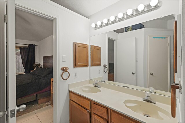 1511 Miller Ave, Katy, TX 77493 - full bathroom featuring double vanity, tile patterned flooring, and a sink
