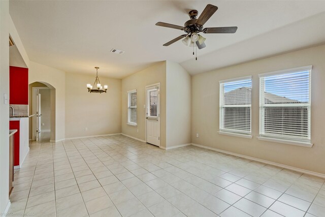 1056 Decker Dr, Fate, TX 75189 - unfurnished room featuring visible vents, arched walkways, ceiling fan with notable chandelier, vaulted ceiling, and light tile patterned floors