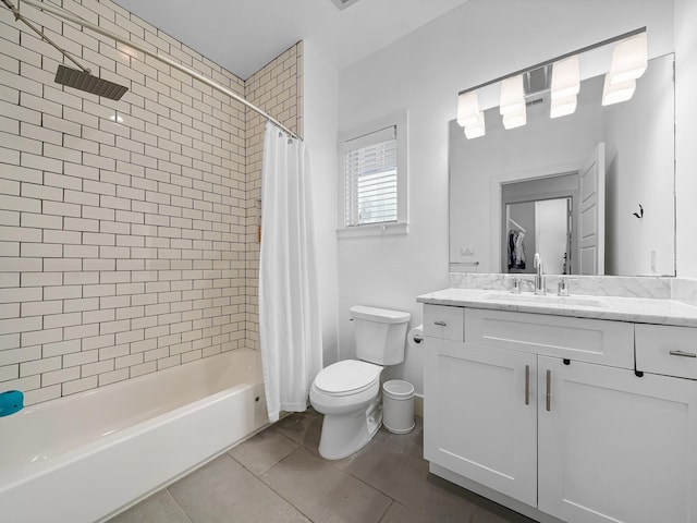 bathroom with vanity, toilet, tile patterned flooring, and shower / bath combo with shower curtain