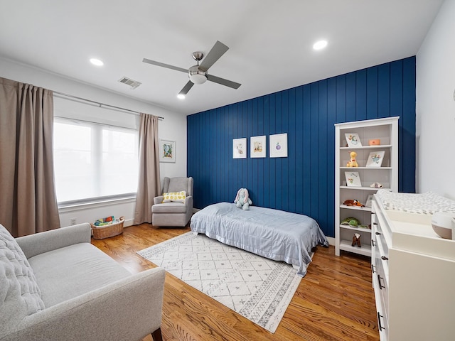 bedroom with recessed lighting, wood finished floors, visible vents, and a ceiling fan