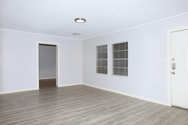 617 Hurst St, Angleton, TX 77515 - unfurnished room featuring baseboards, wood finished floors, and crown molding