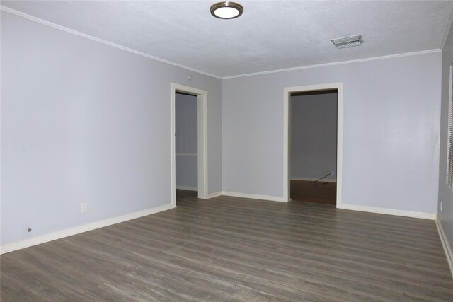 617 Hurst St, Angleton, TX 77515 - spare room featuring dark wood-type flooring, crown molding, visible vents, baseboards, and a textured ceiling