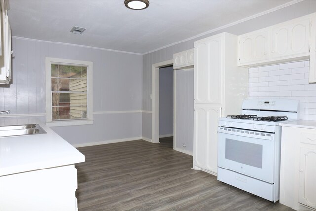 617 Hurst St, Angleton, TX 77515 - kitchen featuring a sink, dark wood-style flooring, white range with gas cooktop, visible vents, and white cabinetry