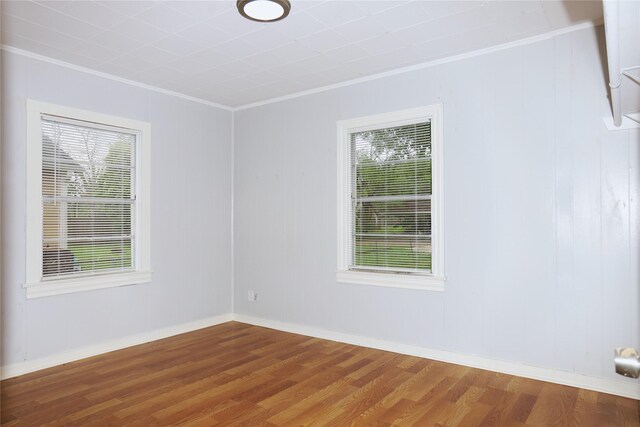 617 Hurst St, Angleton, TX 77515 - spare room with wood finished floors, ornamental molding, and baseboards
