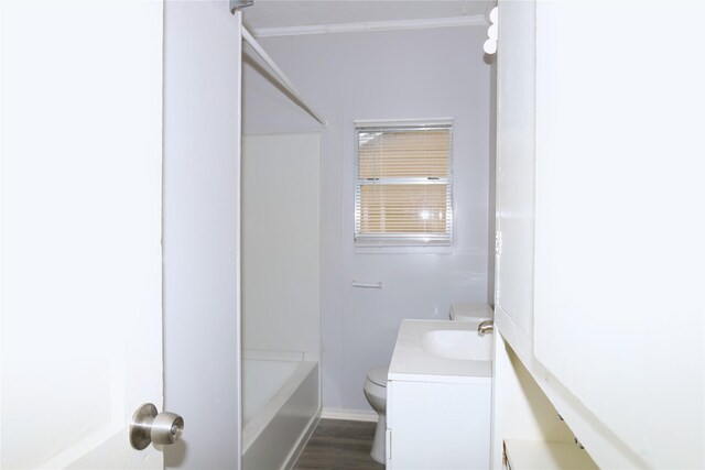 617 Hurst St, Angleton, TX 77515 - full bath with toilet, ornamental molding, shower / bath combination, wood finished floors, and vanity