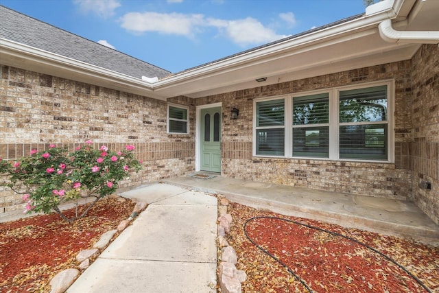 1613 Willow View St, La Porte, TX 77571 - entrance to property featuring brick siding, covered porch, and roof with shingles
