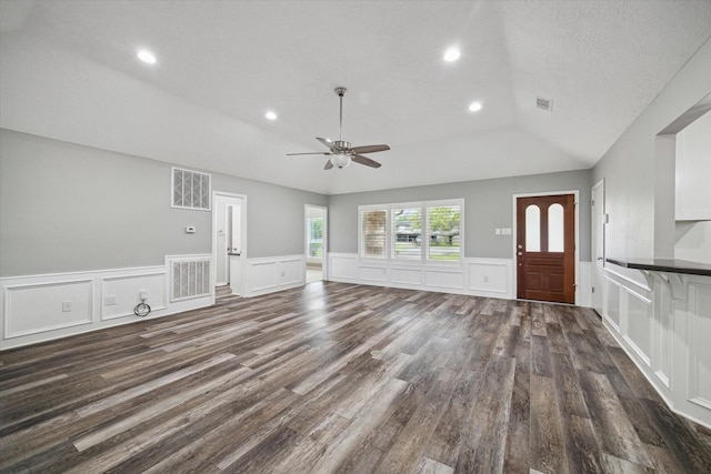 1613 Willow View St, La Porte, TX 77571 - unfurnished living room with vaulted ceiling, a ceiling fan, dark wood-type flooring, recessed lighting, and wainscoting