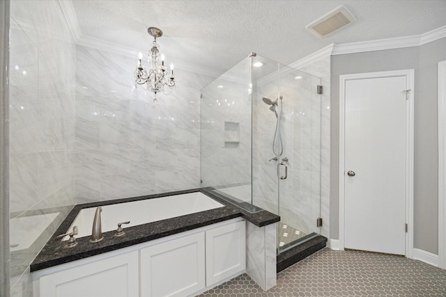 1613 Willow View St, La Porte, TX 77571 - bathroom featuring a shower stall, a bath, ornamental molding, a chandelier, and a textured ceiling