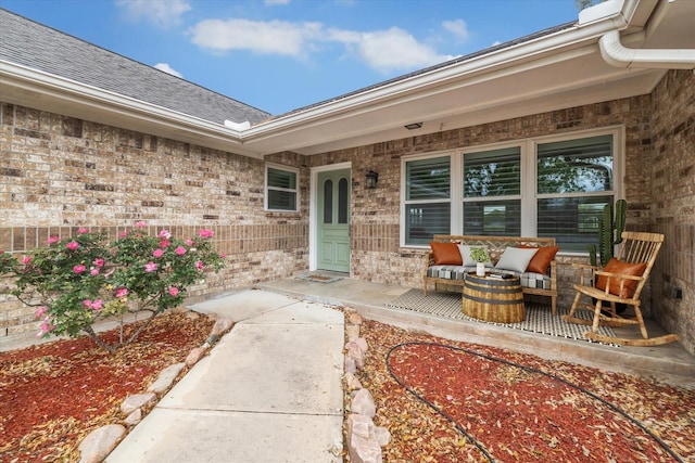 1613 Willow View St, La Porte, TX 77571 - view of exterior entry with brick siding, covered porch, and roof with shingles