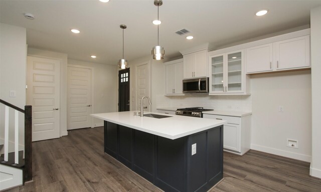 305 E 40th St Unit B, Houston, TX 77018 - kitchen featuring white cabinets, dark wood-type flooring, visible vents, stainless steel appliances, and a sink