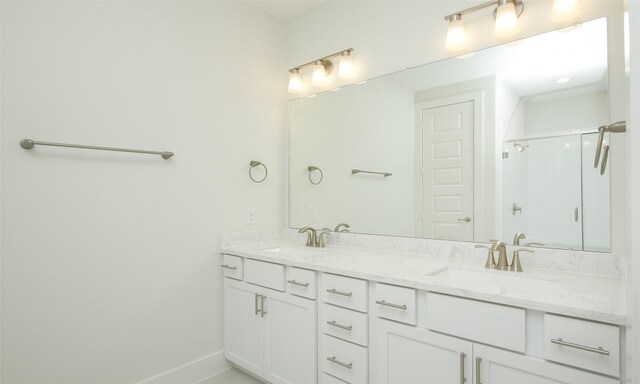 305 E 40th St Unit B, Houston, TX 77018 - bathroom featuring a sink, baseboards, double vanity, and a stall shower