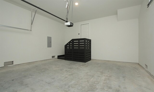 305 E 40th St Unit B, Houston, TX 77018 - garage with electric panel and a garage door opener
