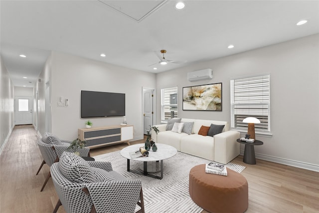 3513 Ursuline St, Galveston, TX 77550 - living area featuring baseboards, recessed lighting, a wall unit AC, and light wood-style floors