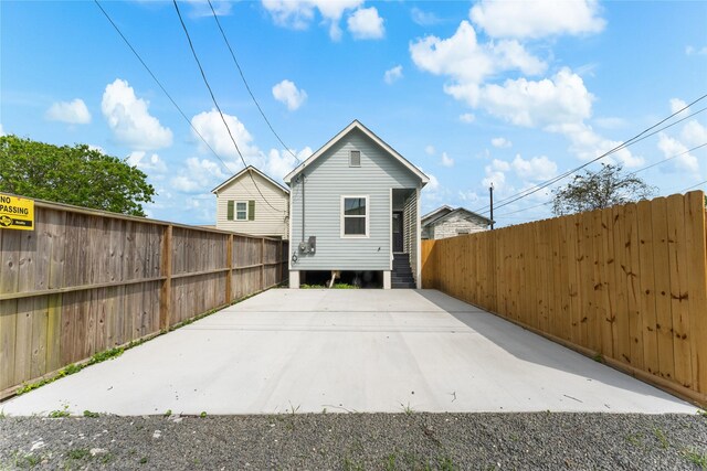 3513 Ursuline St, Galveston, TX 77550 - rear view of property with fence and entry steps