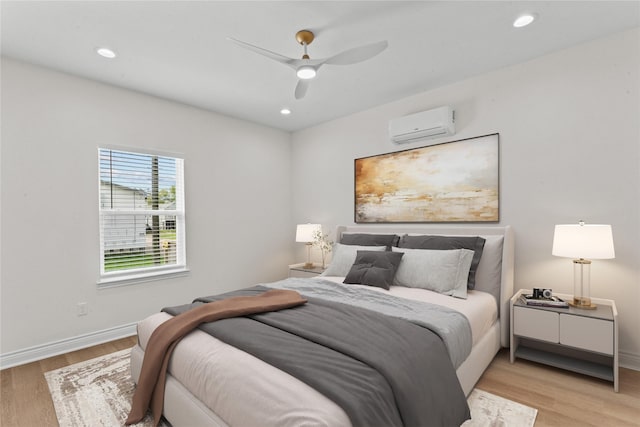 3513 Ursuline St, Galveston, TX 77550 - bedroom featuring light wood-style floors, recessed lighting, and an AC wall unit