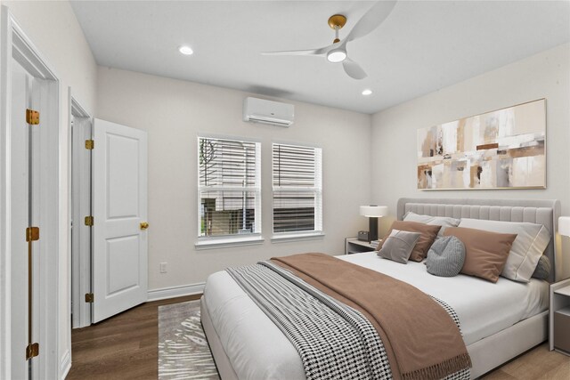 3513 Ursuline St, Galveston, TX 77550 - bedroom with baseboards, wood finished floors, a wall unit AC, and recessed lighting
