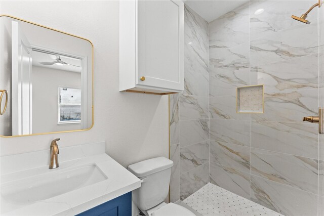 3513 Ursuline St, Galveston, TX 77550 - bathroom featuring toilet, tiled shower, and vanity