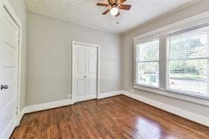 6657 Stearns St, Houston, TX 77021 - unfurnished bedroom featuring ceiling fan, baseboards, and wood finished floors