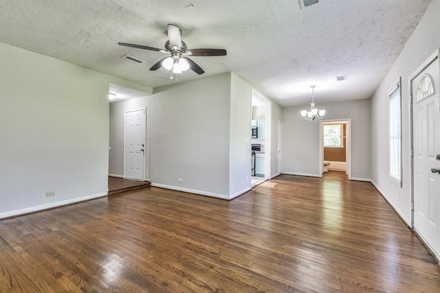 6657 Stearns St, Houston, TX 77021 - unfurnished living room featuring a textured ceiling, ceiling fan with notable chandelier, dark wood finished floors, and visible vents