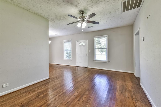6657 Stearns St, Houston, TX 77021 - foyer entrance featuring visible vents, baseboards, a ceiling fan, and wood finished floors