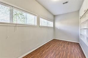 6657 Stearns St, Houston, TX 77021 - unfurnished room featuring wood finished floors, baseboards, and visible vents