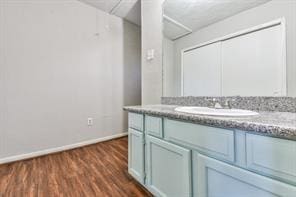 6657 Stearns St, Houston, TX 77021 - bathroom with wood finished floors, vanity, and baseboards