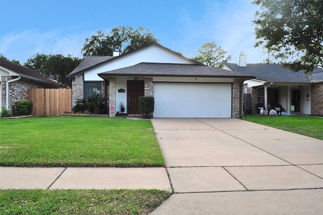 1531 Dan Cox Ave, Katy, TX 77493 - ranch-style house with fence, concrete driveway, a front yard, and a garage