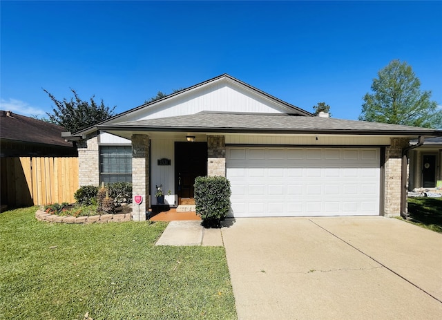 1531 Dan Cox Ave, Katy, TX 77493 - view of front facade featuring fence, a shingled roof, a front lawn, concrete driveway, and a garage