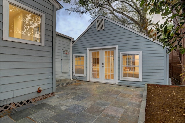 rear view of property featuring a patio