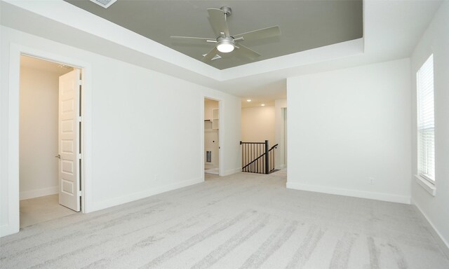 119 E 43rd St Unit A, Houston, TX 77018 - spare room with carpet flooring, a wealth of natural light, a raised ceiling, and ceiling fan