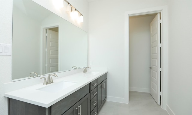 119 E 43rd St Unit A, Houston, TX 77018 - bathroom featuring double vanity, baseboards, and a sink