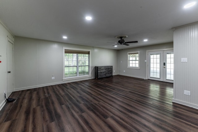 unfurnished living room featuring dark wood-style flooring, french doors, ceiling fan, and baseboards