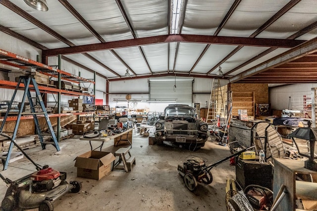 garage with a workshop area and metal wall