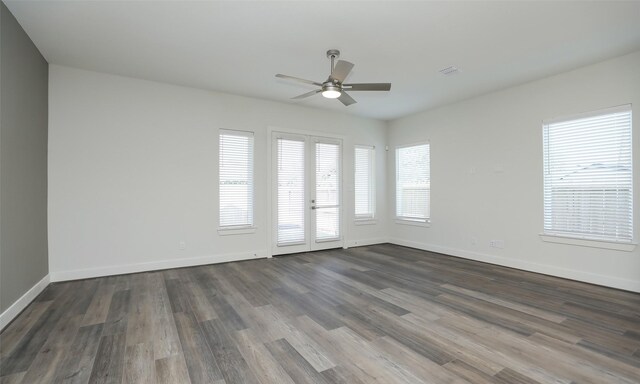 121 E 43rd St Unit B, Houston, TX 77018 - unfurnished room with dark wood-type flooring, ceiling fan, and baseboards