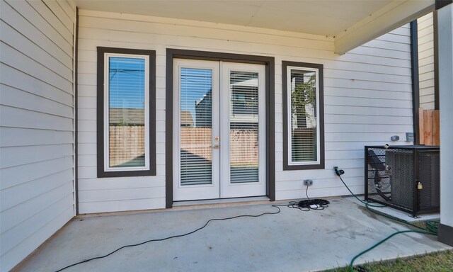 121 E 43rd St Unit B, Houston, TX 77018 - view of exterior entry with a patio area, french doors, and cooling unit