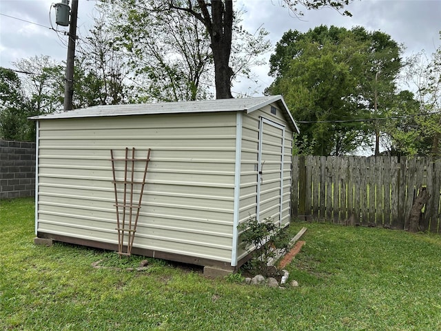 view of shed with fence
