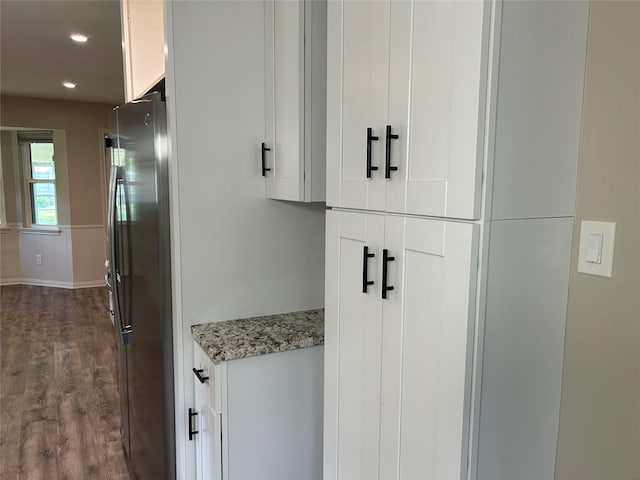 room details with recessed lighting, freestanding refrigerator, and wood finished floors