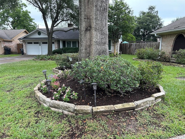 6018 Rena St, Houston, TX 77092 - view of yard featuring concrete driveway and a garage