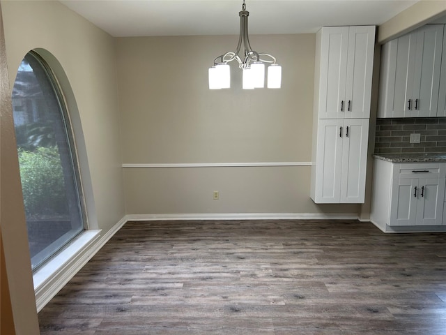 6018 Rena St, Houston, TX 77092 - unfurnished dining area featuring a chandelier and dark wood-type flooring
