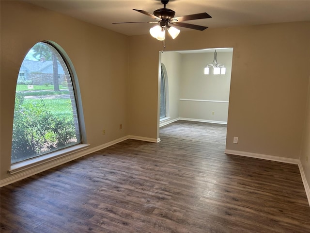 6018 Rena St, Houston, TX 77092 - empty room featuring plenty of natural light, dark wood-style flooring, and a ceiling fan
