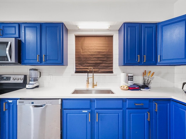 8007 Beluche Dr, Galveston, TX 77551 - kitchen with a sink, blue cabinets, and appliances with stainless steel finishes