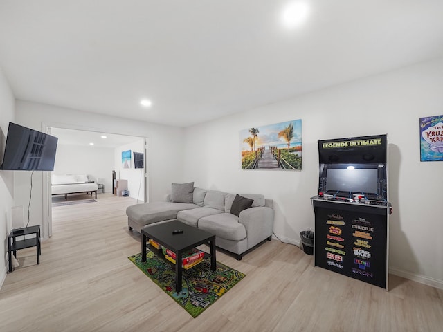 8007 Beluche Dr, Galveston, TX 77551 - living room featuring baseboards and light wood-style flooring