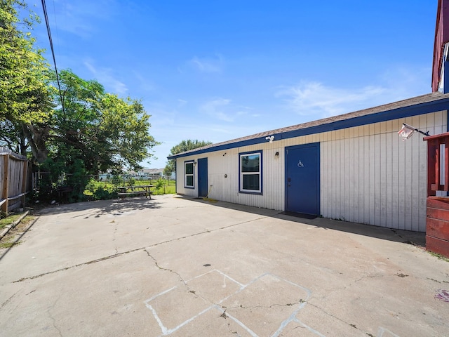 8007 Beluche Dr, Galveston, TX 77551 - rear view of house featuring fence and a patio area