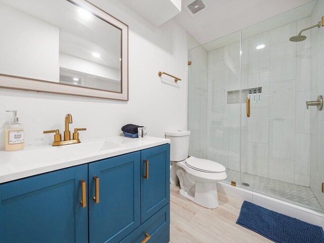 8007 Beluche Dr, Galveston, TX 77551 - full bathroom featuring toilet, vanity, a shower stall, and visible vents