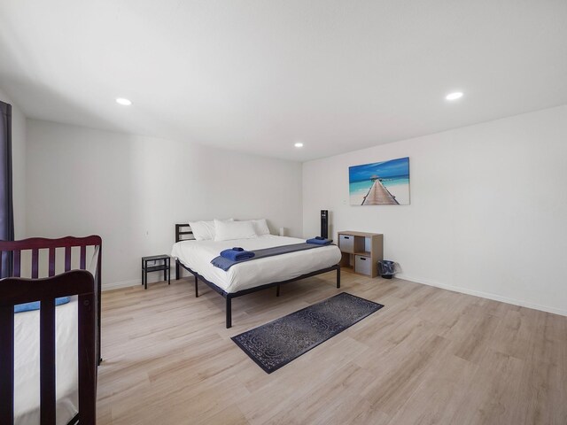 8007 Beluche Dr, Galveston, TX 77551 - bedroom with baseboards, wood finished floors, and recessed lighting