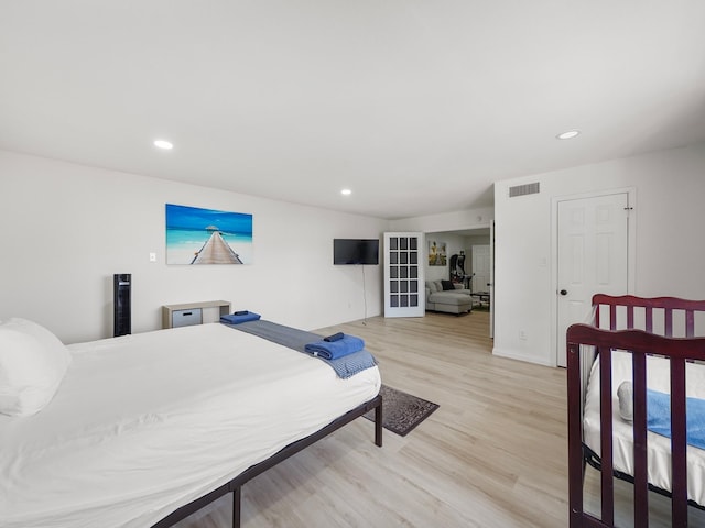 8007 Beluche Dr, Galveston, TX 77551 - bedroom featuring light wood finished floors, baseboards, visible vents, and recessed lighting