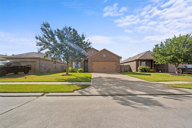 7529 Topaz Way, Texas City, TX 77591 - view of front of property with brick siding, concrete driveway, an attached garage, and a front lawn