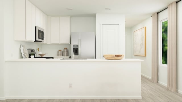 12511 Lady Slipper Rd, Houston, TX 77038 - kitchen featuring light countertops, stove, stainless steel microwave, white cabinets, and fridge with ice dispenser