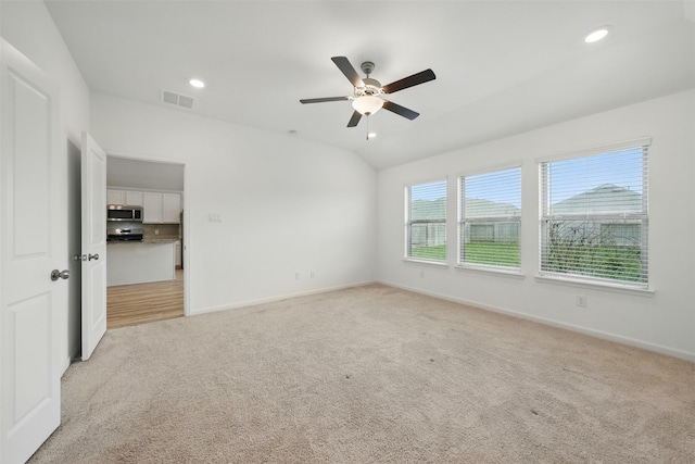 spare room featuring visible vents, recessed lighting, a ceiling fan, and light carpet