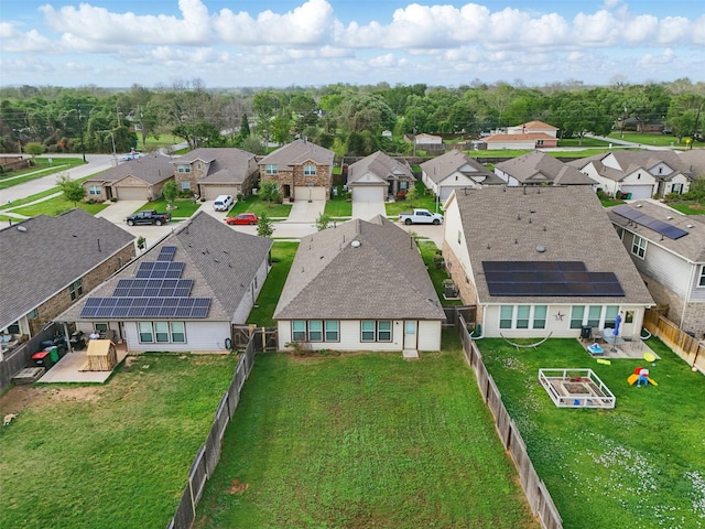 birds eye view of property with a residential view